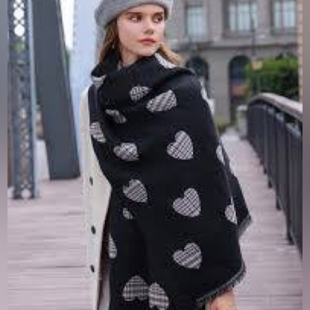 Stylish plaid scarf featuring a black heart pattern.